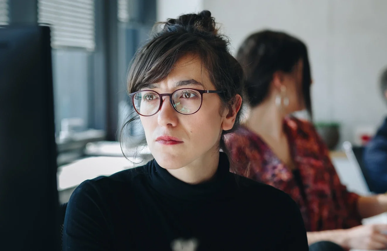 Regulatory consultant reviewing documentation at a desk
